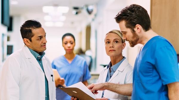 Thumbnail image of doctors discussing in a hospital setting