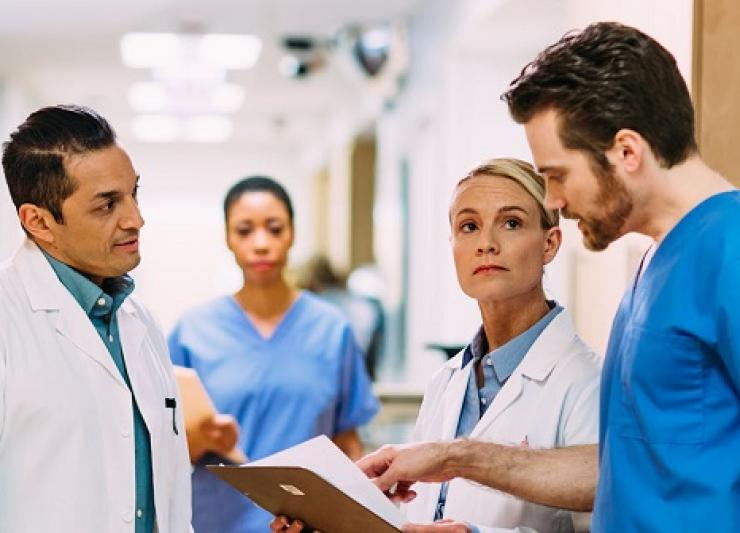 Thumbnail image of doctors discussing in a hospital setting